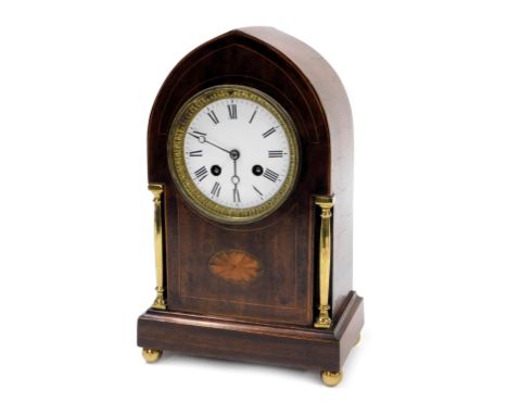 An Edwardian mahogany cased mantle clock, circular enamel dial bearing Roman numerals, eight day movement with bell strike, t