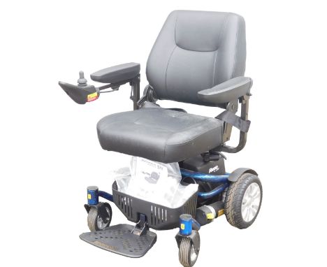 A Roma Medical Reno Elite powerchair, model P325, with battery and instructions.