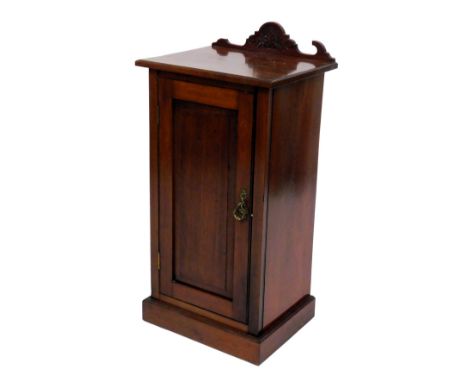 A Victorian mahogany pot cupboard, the panelled door opening to reveal a single shelf, raised on a plinth base, 87cm high, 42