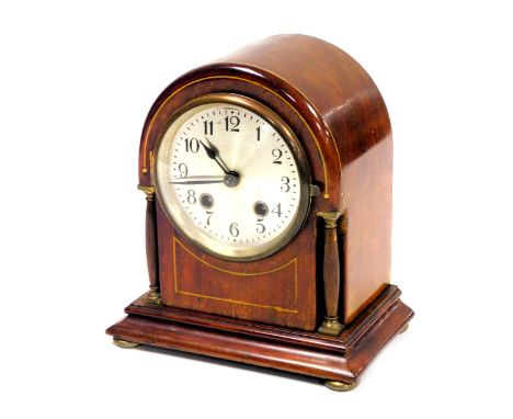 An Edwardian mahogany cased mantel clock, circular silvered dial bearing Arabic numerals, eight day movement with coil strike