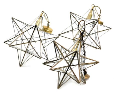 A pair of tetrahedron star shaped lights, 36cm high, and a further ceiling light, 33cm high. (3)
