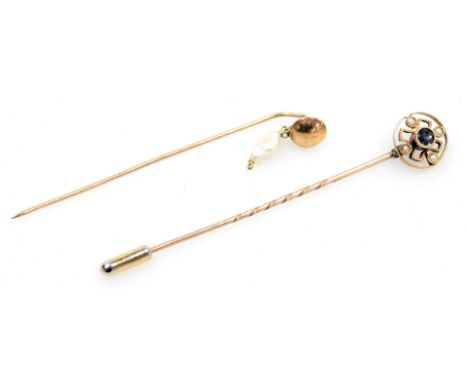An Edwardian sapphire and seed pearl tie pin, in a circular openwork design, in yellow metal, stamped 15ct, and further tie p