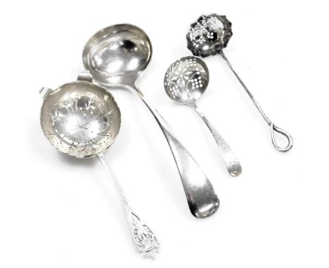 An Elizabeth II Scottish silver sugar sifting spoon, with a thistle terminal, Edinburgh 1960, and two further sugar sifting s