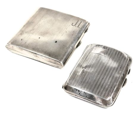 A George V silver cigarette case, with engine turned decoration, engraved finely with initials JI, Birmingham 1928, and a fur