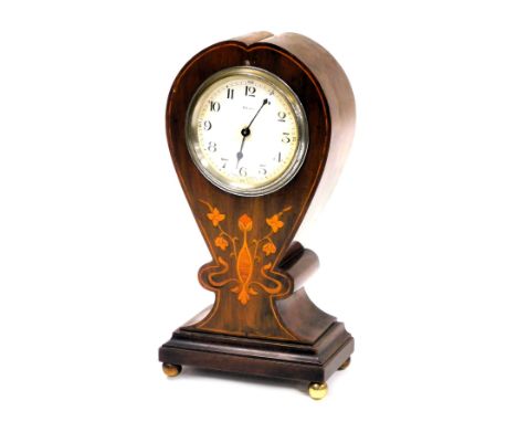 A late 19thC French art nouveau mahogany balloon cased mantel clock, circular dial bearing Arabic numerals, eight day clockwo