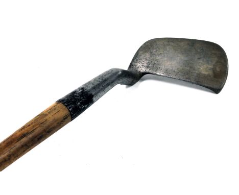 An early 20thC hickory shafted niblick golf club, attributed to Tom Stewart, bears pipe mark, 91cm high. 