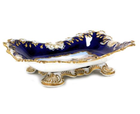 An early 19thC Chamberlains Worcester porcelain basket, handle lacking, painted with a view of Worcester, within a cobalt blu