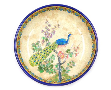 An early 20thC Longwy pottery bowl, of footed form, enamel decorated with a peacock on an apple blossom branch, printed mark,