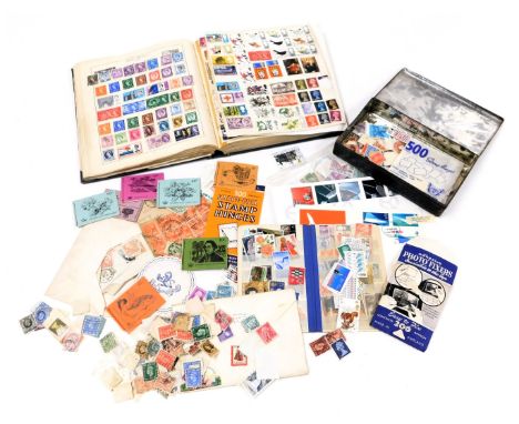 Philately. Great Britain and world stamps, QV-EII, in a Strand stamp album, together with a tin of loose stamps. (2)