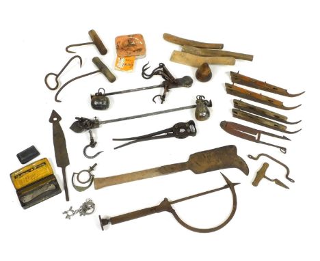 Assorted vintage tools, including a thatcher's needle, vintage wire cutters, cast iron sliding scales and a billhook, togethe