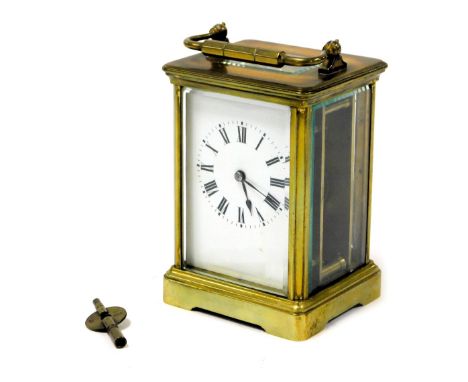 An early 20thC brass cased carriage clock, rectangular enamel dial bearing Roman numerals, single barrel movement, the case o