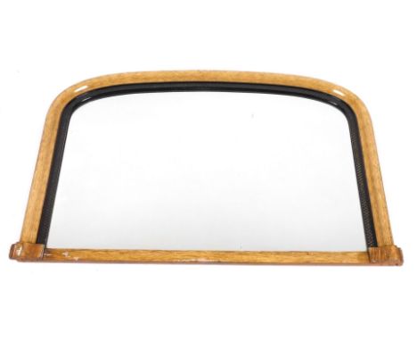 A Victorian light oak and ebonised over mantle mirror, 68cm x 105cm.