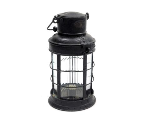 A late 19thC Eli Griffiths black metal railway lantern, bears oval plaque, 34cm high.