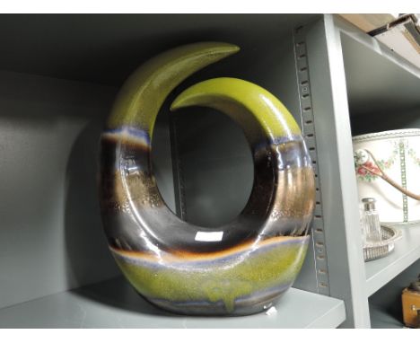 A vintage ceramic abstract sculpture with green and lustre glaze