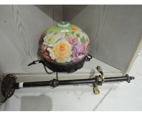 A vintage style light fitting with floral print and cast effect fitment