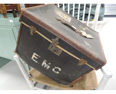 A vintage travel trunk, bearing railway labels, including 1930s