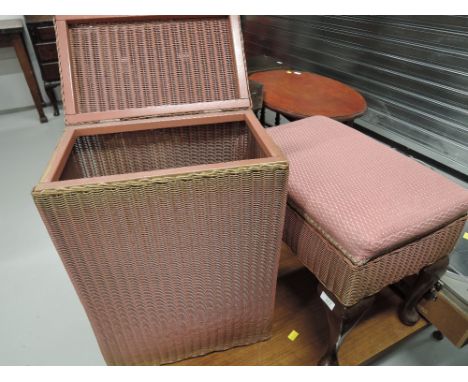 A vintage Lloyd Loom style linen basket and similar stool