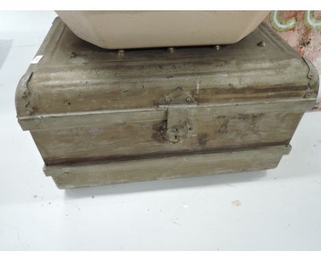 A vintage metal tin trunk
