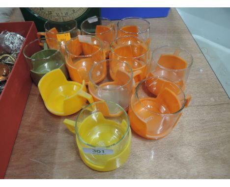 A selection of vintage Pyrex plastic and glass cups