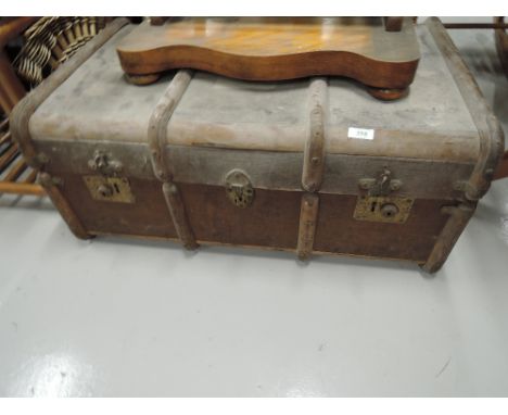 A vintage travel trunk, having vintage railway labels 