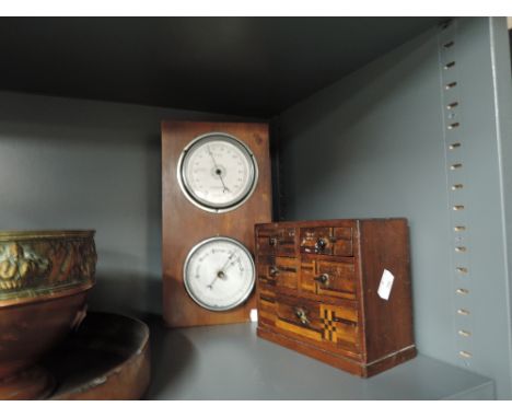 A vintage wall mounted barometer and trinket box