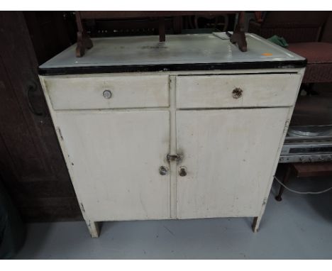 A vintage enamelled kitchen base unit