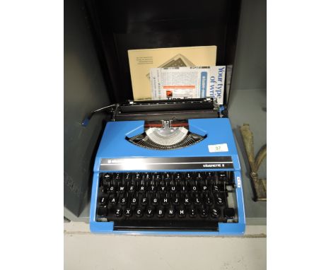 A vintage Silver Reed typewriter in blue