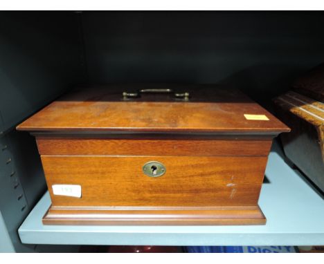 A vintage treen trinket box with brass lock