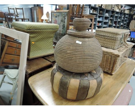 A vintage pouffe and a small snake charmers basket
