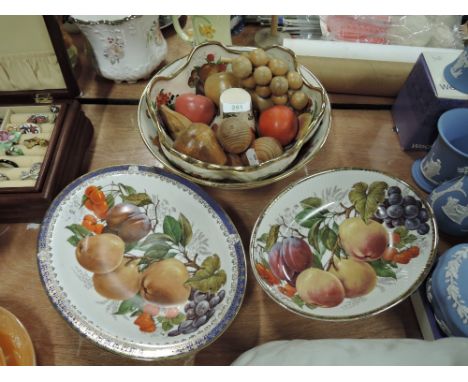 A selection of fruit decorated ceramic bowls and dishes, treen fruit