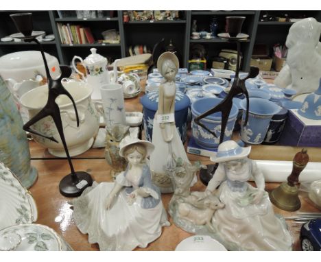 A selection of figures and figurines including Tengra ceramic and brass figure candle sticks