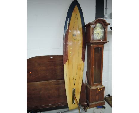 A vintage Tiki surfboardCD - crack to bottom