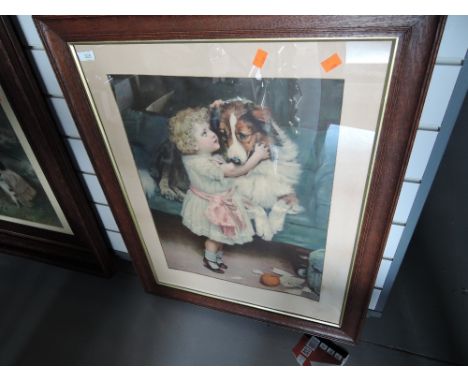 A vintage print of child and dog in period wooden frame