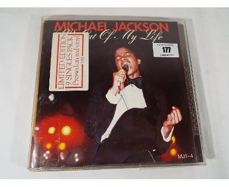 Michael Jackson - an album of 7 inch EP discs pressed on Red vinyl issued in a Limited Edition - Est £20 - £30
