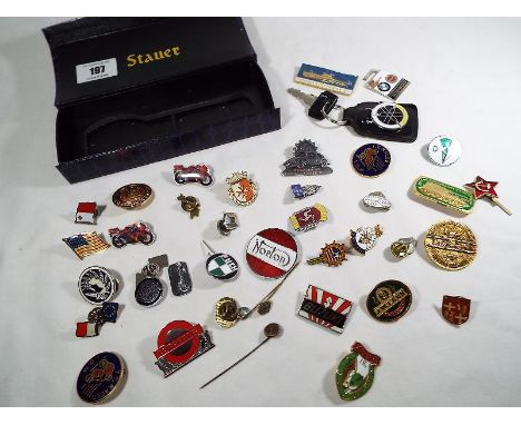 A collection of enamel lapel badges to include various transport related