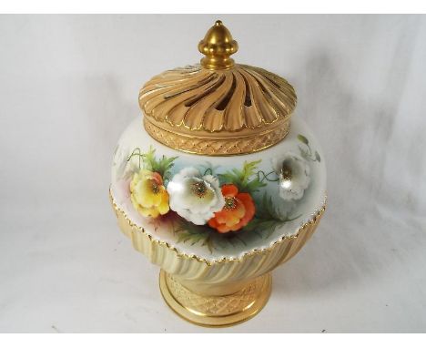 A Royal Worcester potpourri decorated in a floral pattern above a blush ivory ground with a cover with pierced decoration, sh