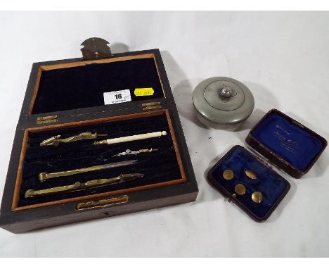A mahogany cased drawing case, at Goldwith Heyes & Co gentleman's tiepin set and a white metal lidded trinket dish inscribed 
