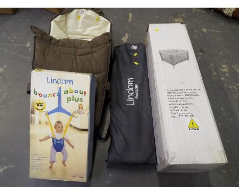 A collection of baby equipment to include a BabyStart travel cot, boxed, a Graco carry cot, a Lindam Bouce About Plus, boxed 
