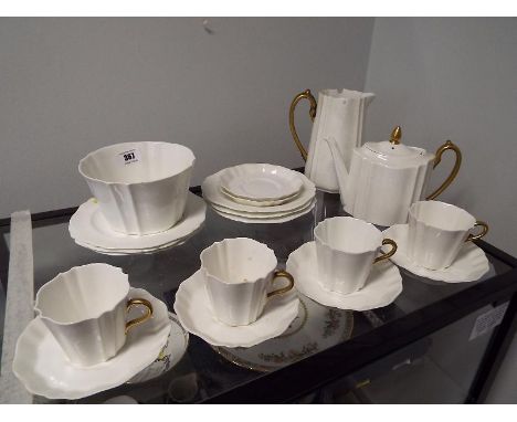 A collection of 20 pieces of Wedgwood tea service decorated in white  and gold (qty)