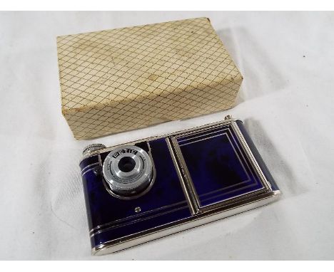 An unusual Coalport blue marbled enamel Petite camera in the form of a powder compact with mirror and lipstick container, box