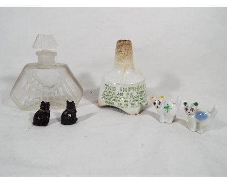 A ceramic pie funnel by Bellringer Brothers Ltd, new Plymouth & Stratford, Grimwades England, a perfume bottle and a collecti