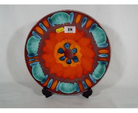 A Poole pottery plate, 27cm (diam)