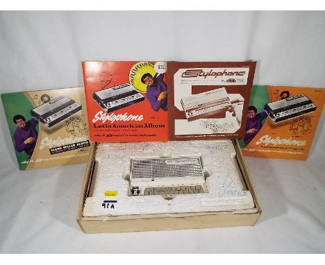 A Stylophone be Dubreq with instruction manual and three Stylophone records and tune books, boxed (qty)