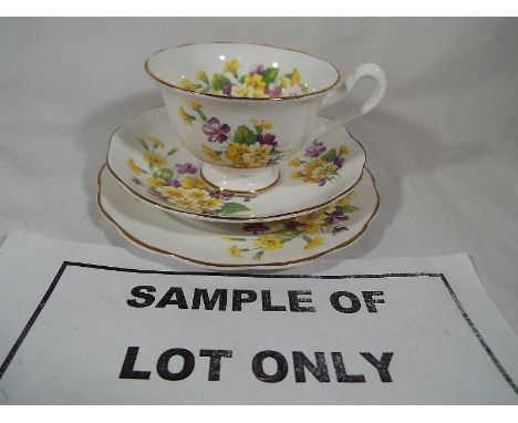 A collection of 18 pieces of ceramic Royal Albert tableware decorated with a floral pattern to include six side plates, six c