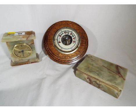 An onyx mantel clock marked to the face N.B. with a matching trinket box, an oak barometer (3)