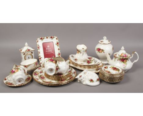 A quantity of Royal Albert ceramics in The Old Country Roses design to include teapot, clock, photo frame, teawares etc.