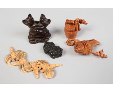 A box of oriental collectables including carved netsuke.