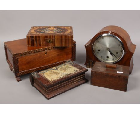 Four wooden boxes one formed as a book, along with a walnut Enfield Westminster chime mantle clock.Condition report intended 