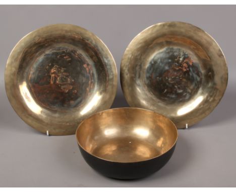A Tibetan bronze sounding bowl and two plates.