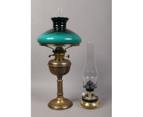 A brass based oil lamp with reeded column, along with a smaller oil lamp.